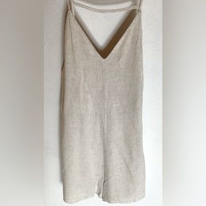 Tan short jump suit.